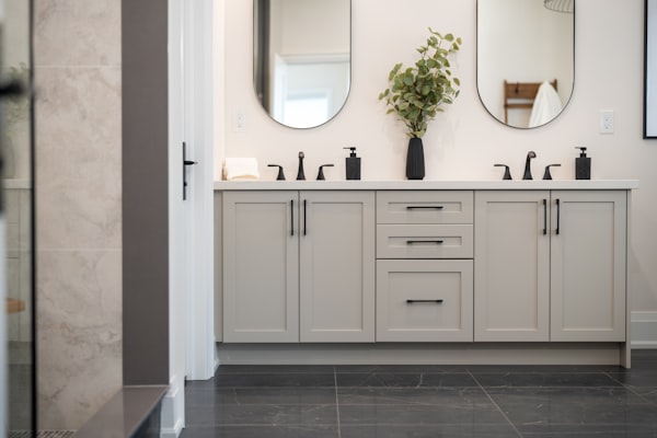 Modern bathroom with double vanity and black fixtures